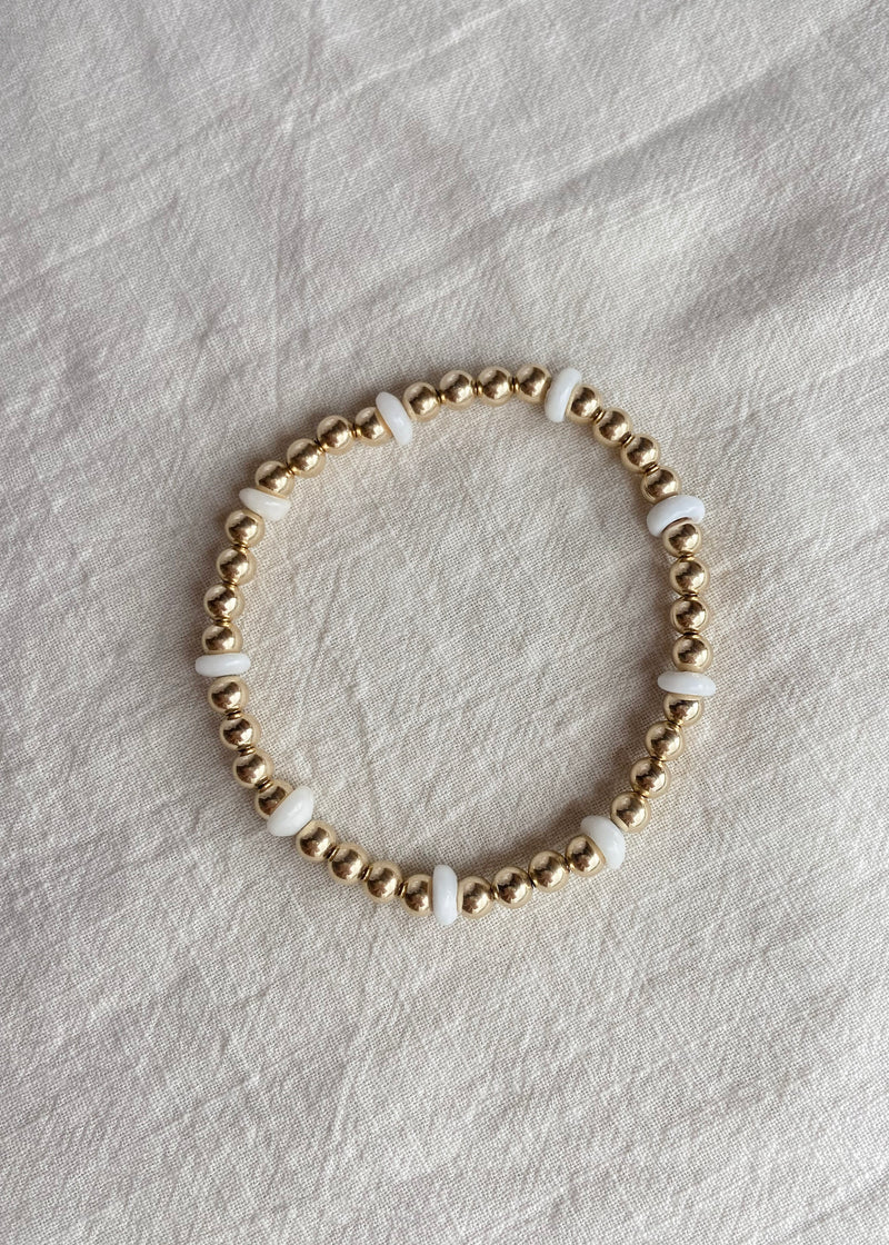 Stretchy 4mm  Puka and Gold Bead Bracelet